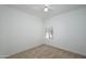 Well-lit bedroom with neutral walls and carpet, plus a window with shutters at 18320 N Las Rocas Way, Surprise, AZ 85374