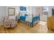 Bedroom with hardwood floors, a comfy bed and large windows at 2201 N Central Ave # 4E, Phoenix, AZ 85004
