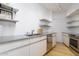 Updated kitchen with stainless steel appliances and double sink at 2201 N Central Ave # 4E, Phoenix, AZ 85004
