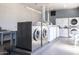 Well-equipped laundry room featuring commercial-grade washers and dryers at 2201 N Central Ave # 4E, Phoenix, AZ 85004