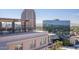 Building exterior showcasing rooftop patio with city and mountain views at 2201 N Central Ave # 4E, Phoenix, AZ 85004
