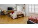 Living room with hardwood floors, comfortable seating, and large windows at 2201 N Central Ave # 4E, Phoenix, AZ 85004