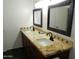 Bathroom with double vanity, granite countertop, and decorative tile at 7221 W Angela Dr, Glendale, AZ 85308