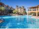 Resort-style pool with lounge chairs and umbrellas at 5450 E Deer Valley Dr # 1209, Phoenix, AZ 85054