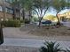 Landscaped grounds with trees, rocks, and parking at 5450 E Deer Valley Dr # 1209, Phoenix, AZ 85054