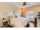 Large bedroom with ceiling fan and hardwood floors at 5450 E Deer Valley Dr # 1209, Phoenix, AZ 85054