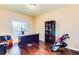 Home office with desk, bookcase, and hardwood floors at 5450 E Deer Valley Dr # 1209, Phoenix, AZ 85054