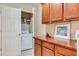 Laundry room with washer, dryer, and cabinets at 5450 E Deer Valley Dr # 1209, Phoenix, AZ 85054