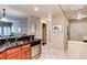 Modern kitchen with wood cabinets, granite counters, and stainless appliances at 5450 E Deer Valley Dr # 1209, Phoenix, AZ 85054