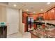 Modern kitchen with wood cabinets, granite counters, and stainless appliances at 5450 E Deer Valley Dr # 1209, Phoenix, AZ 85054