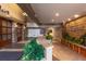 Building lobby with stone and wood accents and lush plants at 5450 E Deer Valley Dr # 1209, Phoenix, AZ 85054