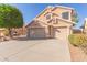 Two-story house with a three-car garage and landscaped front yard at 4356 E Rancho Tierra Dr, Cave Creek, AZ 85331