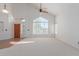 Living room with large window, hardwood floors, and ceiling fan at 4356 E Rancho Tierra Dr, Cave Creek, AZ 85331