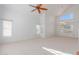 Spacious living room with vaulted ceilings and large windows at 4356 E Rancho Tierra Dr, Cave Creek, AZ 85331