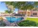 Inviting swimming pool and grassy backyard at 4356 E Rancho Tierra Dr, Cave Creek, AZ 85331
