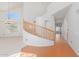 Interior view showcasing a curved staircase with wooden railings at 4356 E Rancho Tierra Dr, Cave Creek, AZ 85331