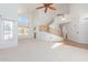 Open living room with high ceilings, and a curved staircase at 4356 E Rancho Tierra Dr, Cave Creek, AZ 85331