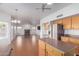 Open concept kitchen with island and views to living room at 4356 E Rancho Tierra Dr, Cave Creek, AZ 85331