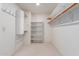 Large walk-in closet with shelves and hanging rods at 4356 E Rancho Tierra Dr, Cave Creek, AZ 85331