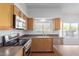 Modern kitchen with stainless steel appliances and wood cabinets at 4356 E Rancho Tierra Dr, Cave Creek, AZ 85331