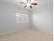 Simple bedroom with ceiling fan and window at 4356 E Rancho Tierra Dr, Cave Creek, AZ 85331