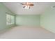 Bright bedroom with window and ceiling fan at 4356 E Rancho Tierra Dr, Cave Creek, AZ 85331