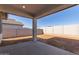 Covered patio overlooking a spacious, unlandscaped backyard at 7400 E White Tail Rd, San Tan Valley, AZ 85143