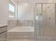 Elegant bathroom with soaking tub and a separate walk-in shower at 7400 E White Tail Rd, San Tan Valley, AZ 85143