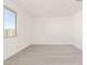 Spacious bedroom with neutral-toned carpet and large window at 7400 E White Tail Rd, San Tan Valley, AZ 85143