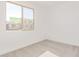 Bright bedroom with carpet flooring and a window offering a view at 7400 E White Tail Rd, San Tan Valley, AZ 85143