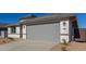 Single-story house with attached gray garage and desert landscaping at 7400 E White Tail Rd, San Tan Valley, AZ 85143