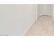 Clean hallway with light wood-look flooring and white walls at 7400 E White Tail Rd, San Tan Valley, AZ 85143