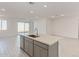 Island kitchen with gray cabinets and stainless steel appliances at 7400 E White Tail Rd, San Tan Valley, AZ 85143
