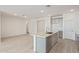 Modern kitchen with gray cabinets, island, and stainless steel appliances at 7400 E White Tail Rd, San Tan Valley, AZ 85143