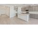 Open kitchen with gray cabinets, large island, and stainless steel appliances at 7400 E White Tail Rd, San Tan Valley, AZ 85143