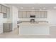 Modern kitchen with gray cabinets, quartz countertops, and stainless steel appliances at 7400 E White Tail Rd, San Tan Valley, AZ 85143