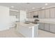 Modern kitchen featuring gray cabinetry, a large island, and stainless steel appliances at 7400 E White Tail Rd, San Tan Valley, AZ 85143