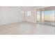 Open living area with light flooring and sliding glass door to patio at 7400 E White Tail Rd, San Tan Valley, AZ 85143