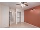 Bedroom with tiled floors, closet, and access to a hallway at 5505 E Mclellan Rd # 9, Mesa, AZ 85205