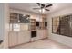 Built-in wet bar with glass-front cabinets and shelving at 5505 E Mclellan Rd # 9, Mesa, AZ 85205