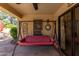 Covered patio with seating area and a swing at 5505 E Mclellan Rd # 9, Mesa, AZ 85205