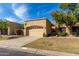 Tan stucco house with a two-car garage and mature trees in front at 5505 E Mclellan Rd # 9, Mesa, AZ 85205
