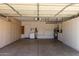 Two-car garage with storage cabinets and shelving at 5505 E Mclellan Rd # 9, Mesa, AZ 85205