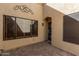 A tiled patio with a security door and window leading into the home at 5505 E Mclellan Rd # 9, Mesa, AZ 85205