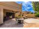 Landscaped backyard with a fire pit and built-in grill at 5505 E Mclellan Rd # 9, Mesa, AZ 85205