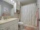 Clean bathroom with shower/tub combo, vanity, and updated fixtures at 9911 W Desert Forest Cir, Sun City, AZ 85351