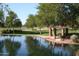 Serene community lake with gazebo and lush green landscaping at 2581 W Shackleton Dr, Anthem, AZ 85086