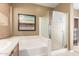 Relaxing bathroom featuring a soaking tub and a separate shower stall at 2581 W Shackleton Dr, Anthem, AZ 85086