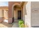 Arched entryway leading to a dark brown front door at 2581 W Shackleton Dr, Anthem, AZ 85086