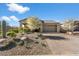 Single-story home with attractive landscaping and a two-car garage at 17543 E Silver Sage Ln, Rio Verde, AZ 85263
